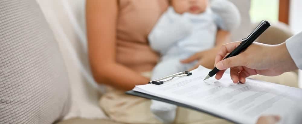 A baby is being diagnose by doctor in the living room, childcare concept